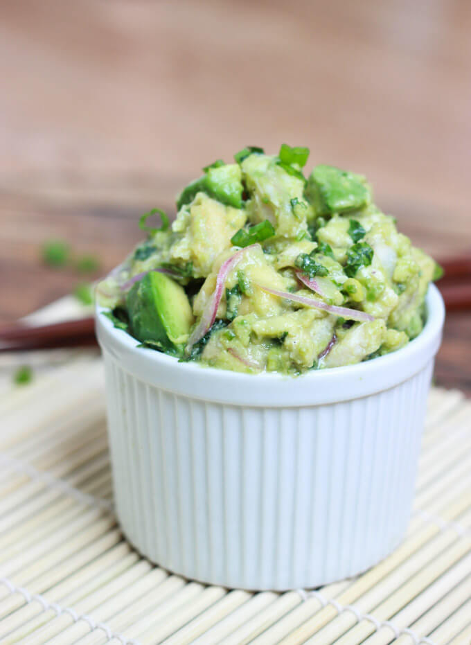 side view tuna salad with avocado in a bowl.