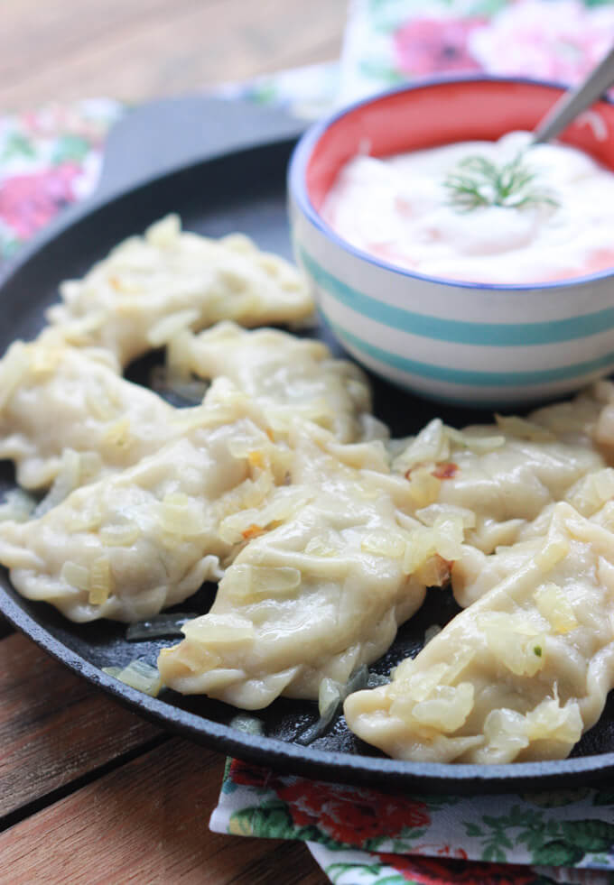 3 ingredient dough and 4 ingredient filling: potatos + crispy bacon + caramelized onion + fresh dill make up this delicious Russian comfort food | littlebroken.com @littlebroken #vareniki #perogies #dough