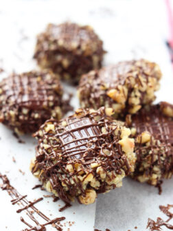 Day 9 of 12 Days of Cookies: chocolate thumbprint cookies with raspberry-caramel filling are a MUST this holiday season. Super soft, sophisticated and tastiest cookie ever! | littlebroken.com @littlebroken