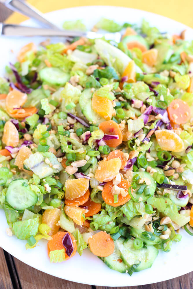 Healthy salad greens combined with crispy veggies and mandarins in a slightly sweet dressing | littlebroken.com @littlebroken