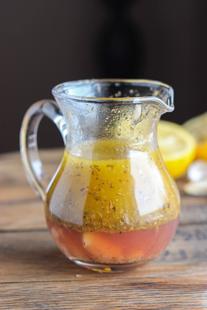 Zoomed out greek dressing in glass container