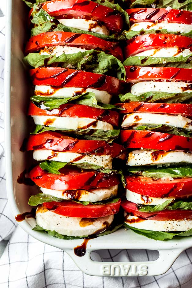 Light and easy appetizer or side dish, loaded with tomatoes, fresh mozzarella, and basil with a sweet balsamic reduction | https://www.littlebroken.com @littlebroken