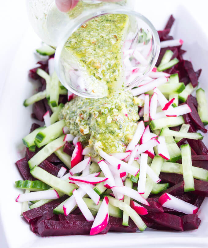 Simple and easy vegetable salad with beets, cucumbers, and radishes, tossed in a crunchy basil pesto vinaigrette | littlebroken.com @littlebroken