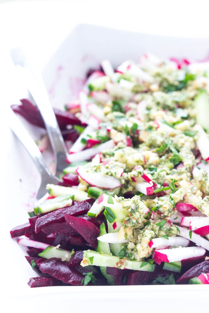 Simple and easy vegetable salad with beets, cucumbers, and radishes, tossed in a crunchy basil pesto vinaigrette | littlebroken.com @littlebroken