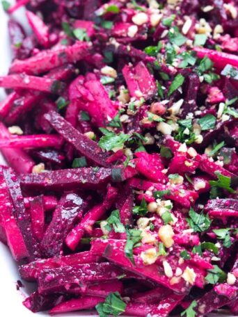 Simple and easy vegetable salad with beets, cucumbers, and beets, tossed in a crunchy basil pesto vinaigrette | littlebroken.com @littlebroken