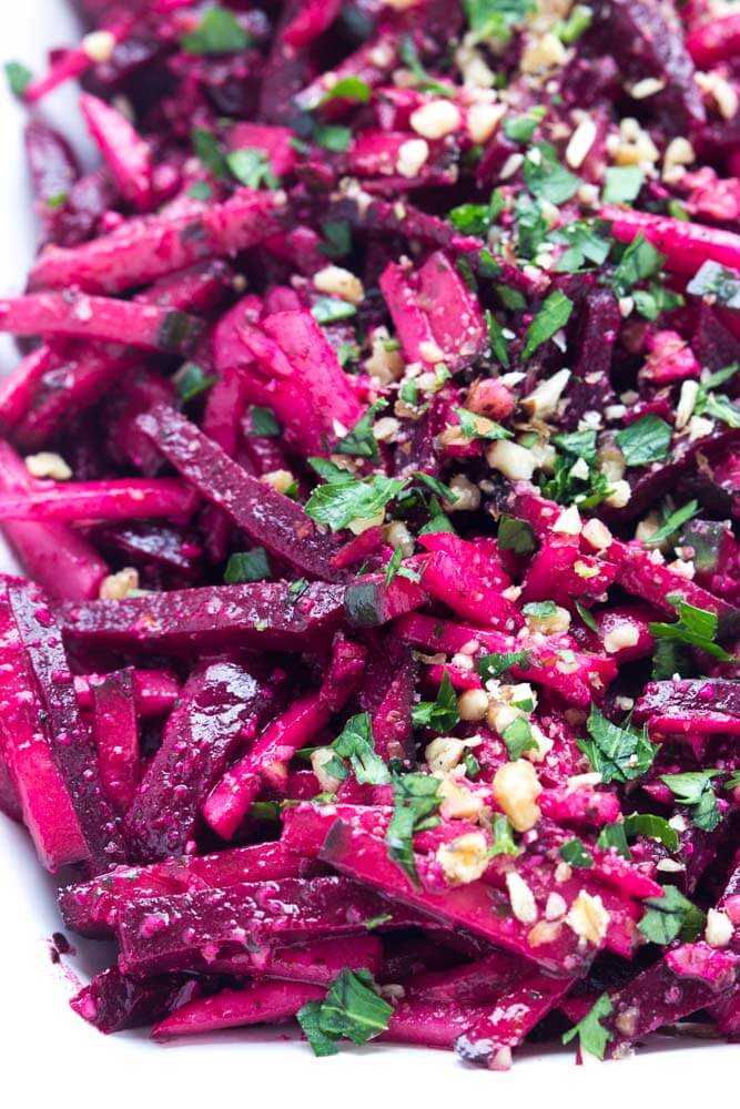 Simple and easy vegetable salad with beets, cucumbers, and radishes, tossed in a crunchy basil pesto vinaigrette | littlebroken.com @littlebroken