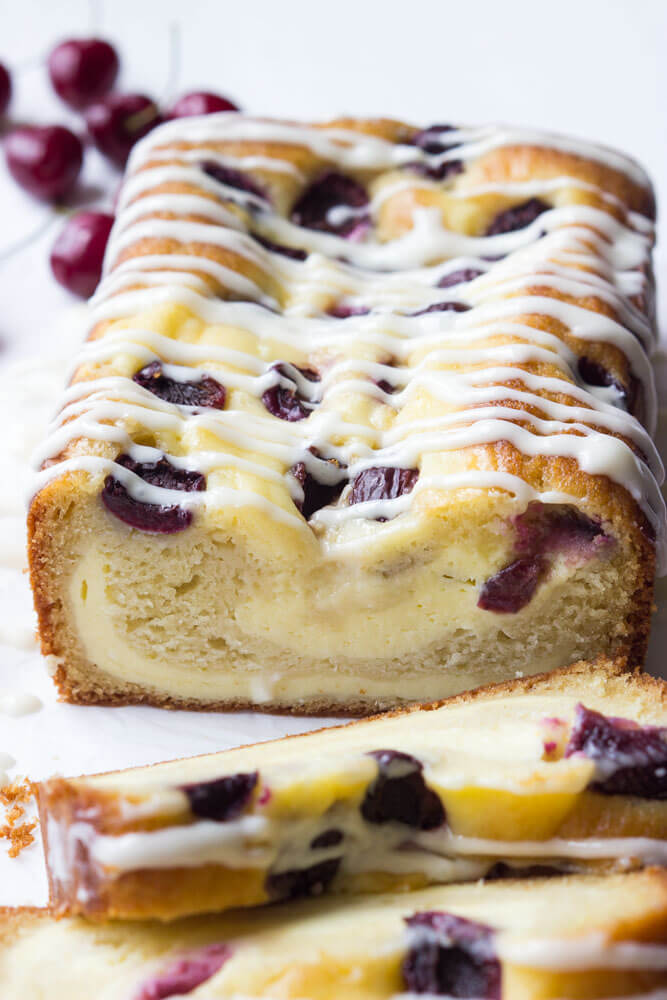 Super moist and flavorful 5 layer coffee cake, made with buttermilk cake layer, cream cheese filling, sweet fresh cherries, and the BEST cream cheese glaze | littlebroken.com @littlebroken