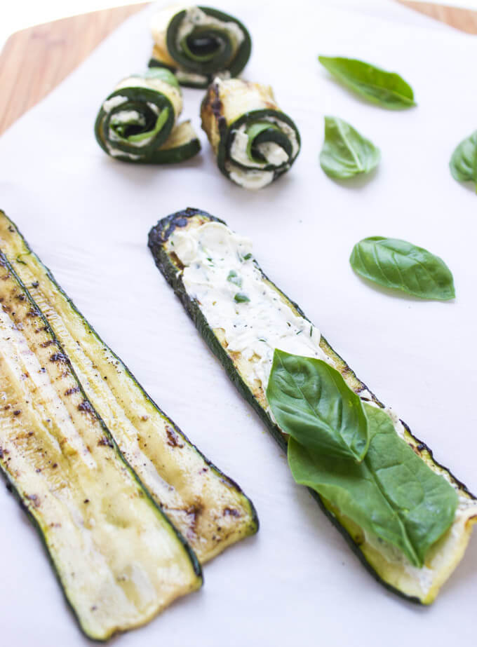 Grilled zucchini filled with herby cream cheese, baby spinach, and aromatic basil. Easy yet elegant side dish or appetizer | littlebroken.com @littlebroken