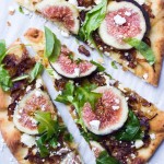 Fresh figs + caramelized onions + arugula + salty feta a top of crisp flatbread. Perfect blend of sweet and savory all in one! | littlebroken.com @littlebroken