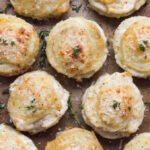 Creamy Potato Stacks with Garlic, Thyme and Parmesan - made in a standard muffin pan, these potato stacks are creamy on the inside and crispy on the outside. Super delicious side for any dinner party! | littlebroken.com @littlebroken