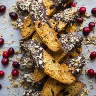 Dark Chocolate Cranberry Almond Biscotti - dunkable, crunchy, packed with almonds and cranberries, then dipped in dark rich chocolate. So addicting and full of flavor | littlebroken.com @littlebroken