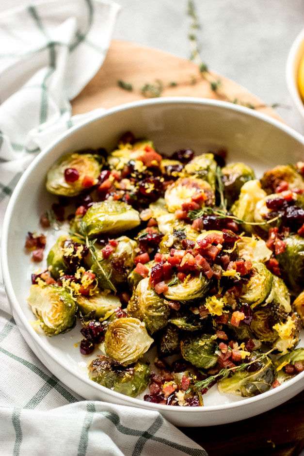 side view lemon roasted brussel sprouts with cranberries and prosciutto