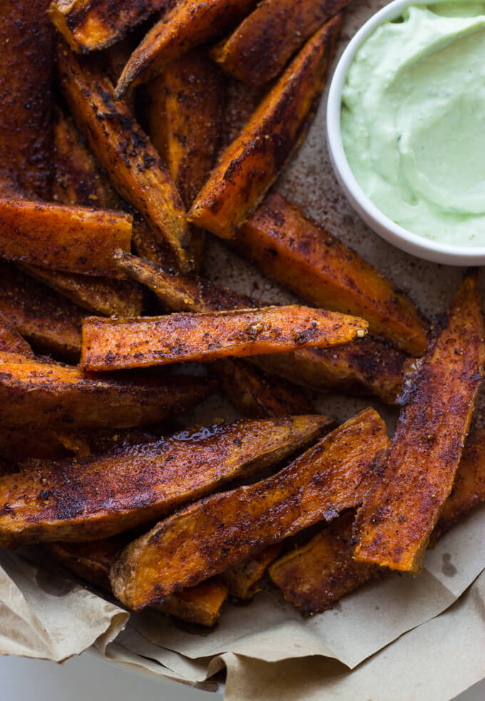 Chili Roasted Sweet Potato Wedges with Avocado Greek Yogurt Aioli - the secret to best crispy potatoes is most likely sitting in your pantry. These will be the last potatoes you will want to make! | littlebroken.com @littlebroken