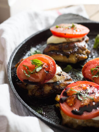 Close up easy caprese chicken in pan.