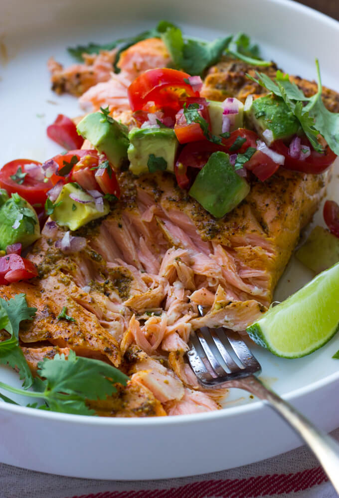 Oven Roasted Chili Lime Salmon with Avocado Salsa - chili lime marinated salmon, roasted in the oven, then topped with fresh avocado tomato salsa. Such easy weeknight dinner! | littlebroken.com @littlebroken