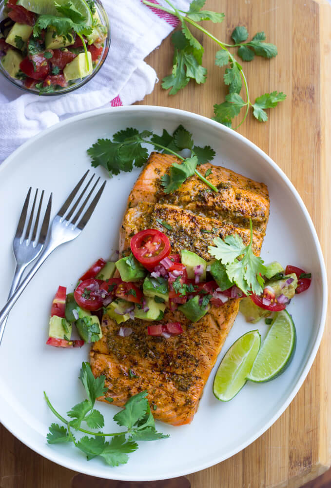 Oven Roasted Chili Lime Salmon with Avocado Salsa - chili lime marinated salmon, roasted in the oven, then topped with fresh avocado tomato salsa. Such easy weeknight dinner! | littlebroken.com @littlebroken