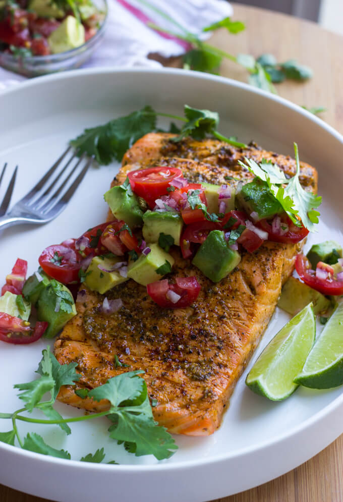 Oven Roasted Chili Lime Salmon with Avocado Salsa - chili lime marinated salmon, roasted in the oven, then topped with fresh avocado tomato salsa. Such easy weeknight dinner! | littlebroken.com @littlebroken