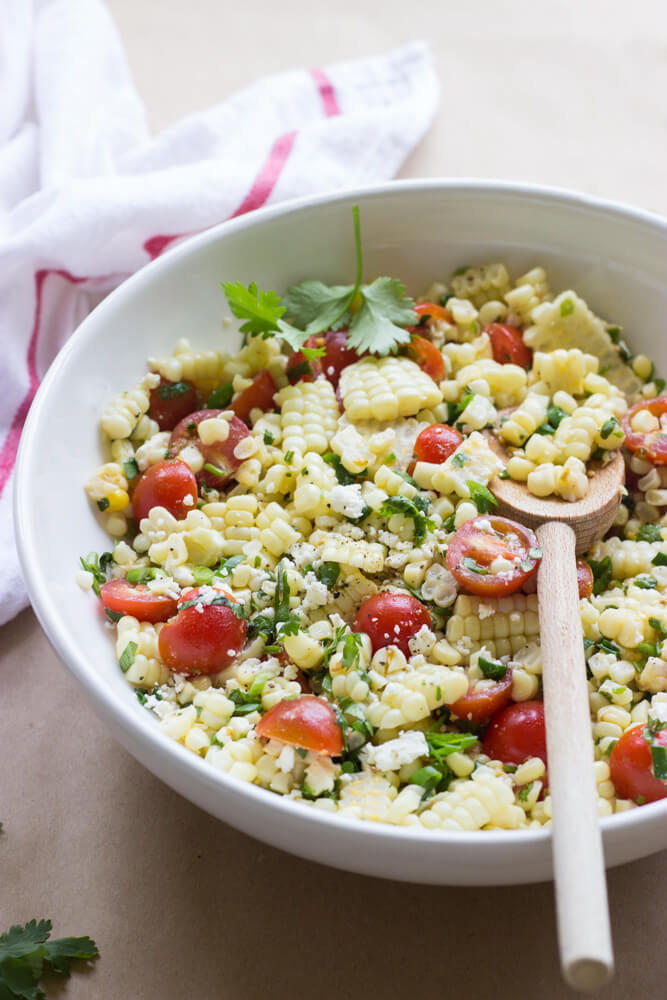 Fresh Sweet Corn Salad with Tomatoes and Feta - the best corn salad to compliment all of your BBQ dishes! | littlebroken.com @littlebroken