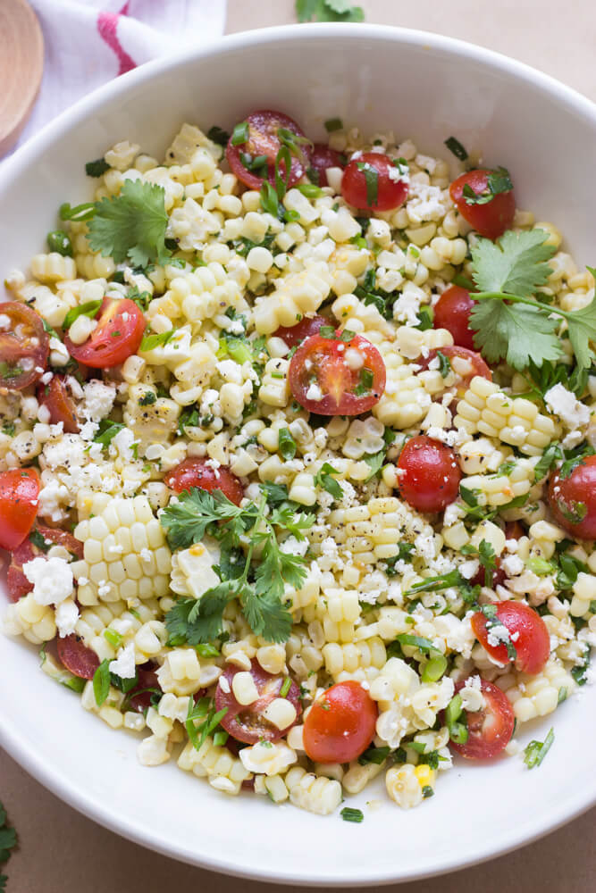 close up of corn salad with feta and tomatoes