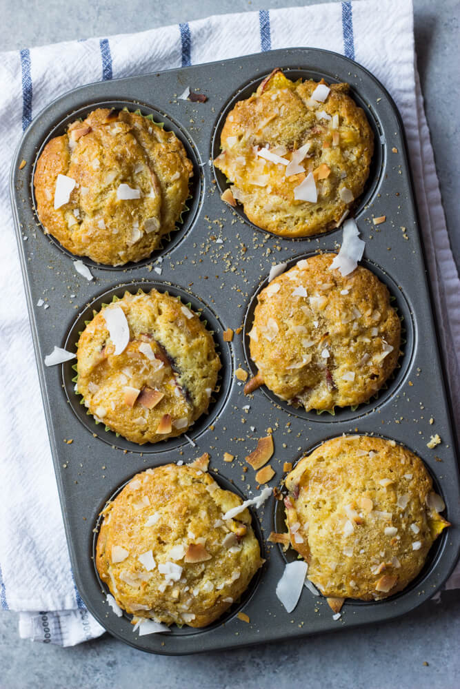 baked fresh peach muffins in a pan