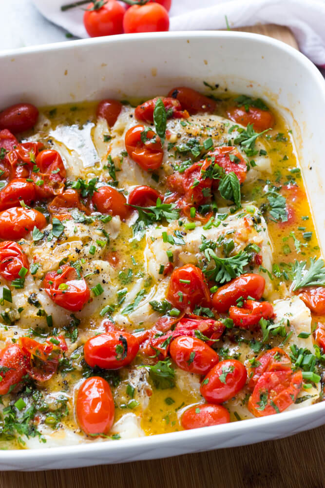 Cod with Tomato and Herb Butter - the best cod recipe you will ever make! Flavorful, flaky, and tender. 
