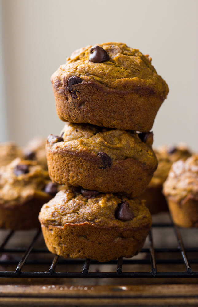 Healthy Chocolate Chip Pumpkin Muffins - made with coconut oil, white whole wheat flour, and sweetened with honey. These are by far the BEST healthy pumpkin muffins | littlebroken.com @littlebroken