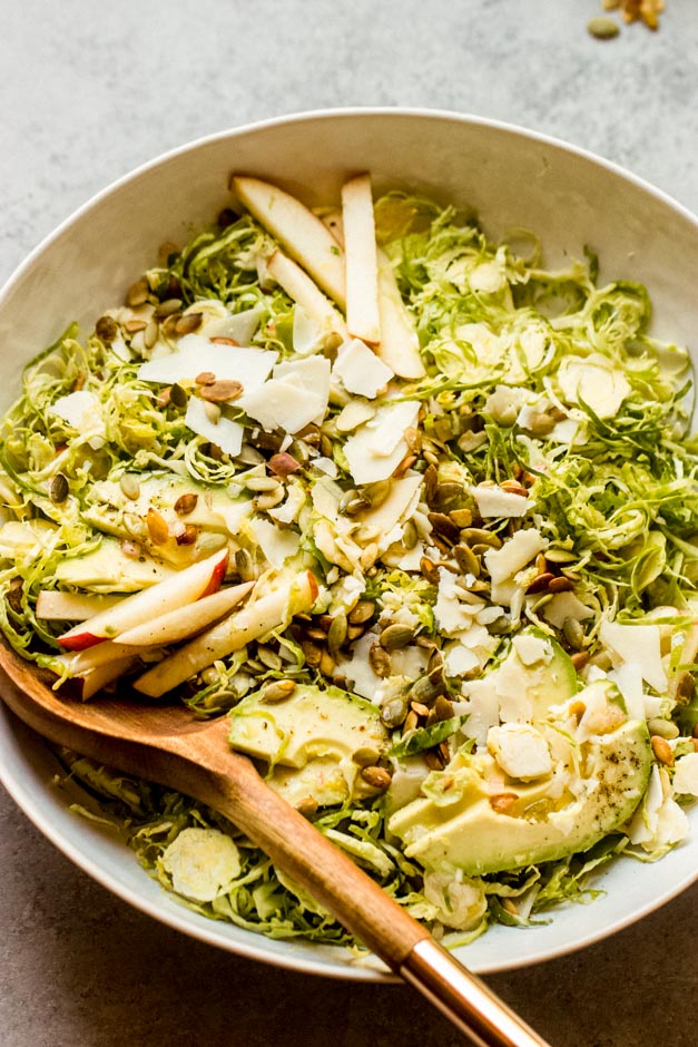close up shredded brussel sprouts salad with apples