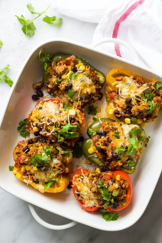 healthy turkey stuffed peppers in a baking dish