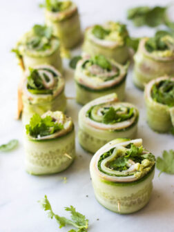 Ham and Cheese Cucumber Roll Ups - low carb and healthy roll ups with avocado-hummus, ham, cheese, cilantro, and spinach | littlebroken.com @littlebroken