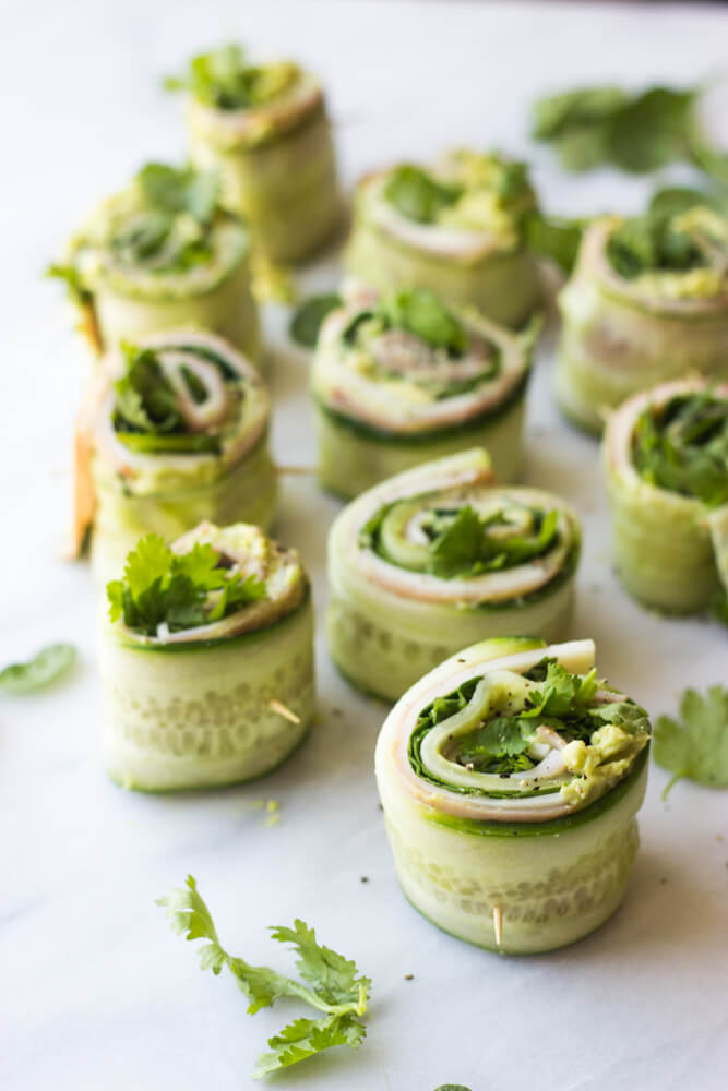 Ham and Cheese Cucumber Roll Ups - low carb and healthy roll ups with avocado-hummus, ham, cheese, cilantro, and spinach | littlebroken.com