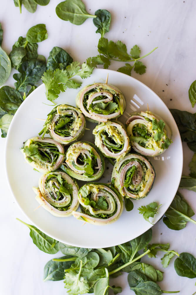 Ham and Cheese Cucumber Roll Ups - low carb and healthy roll ups with avocado-hummus, ham, cheese, cilantro, and spinach | littlebroken.com 
