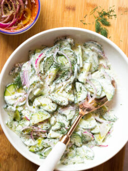 Greek Cucumber Salad - made with marinated onions and creamy Greek yogurt dressing. This simple summer side is insanely delicious and easy to make! | littlebroken.com @littlebroken