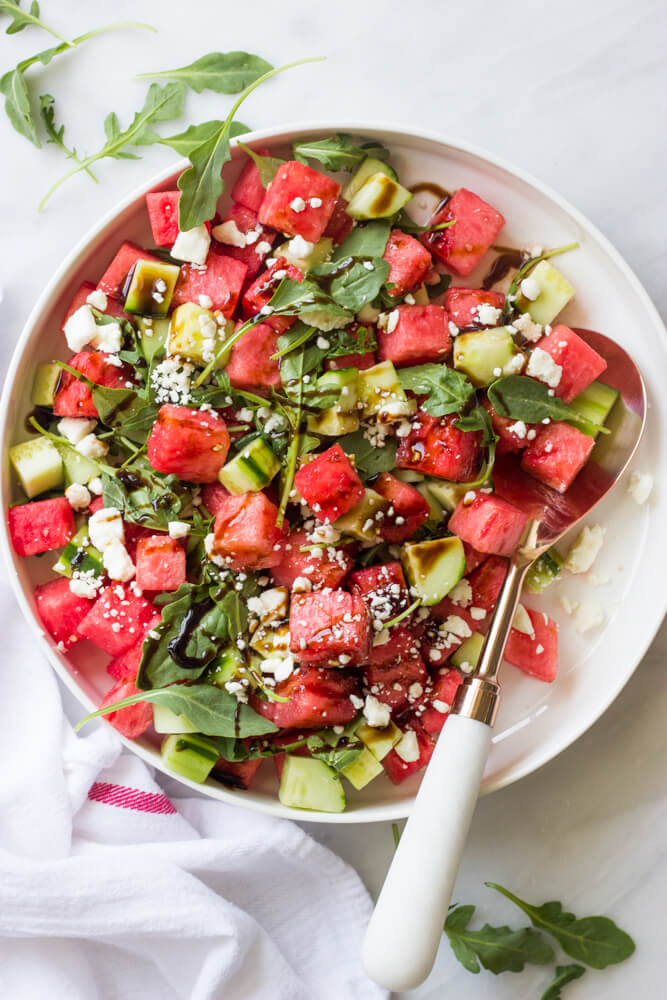 watermelon cucumber salad in white bowl