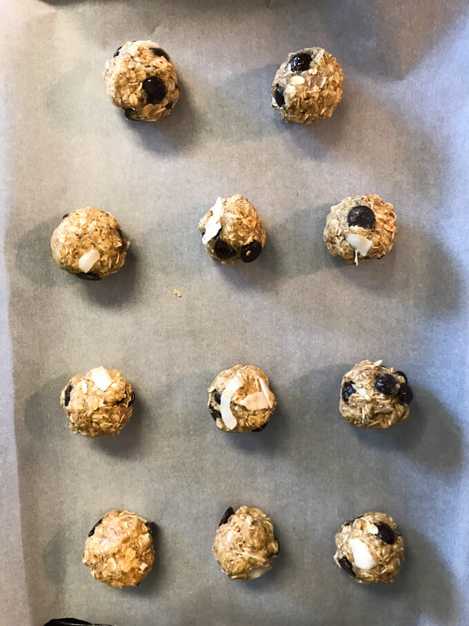 Rolled up lactation cookie dough on parchment lined baking sheet