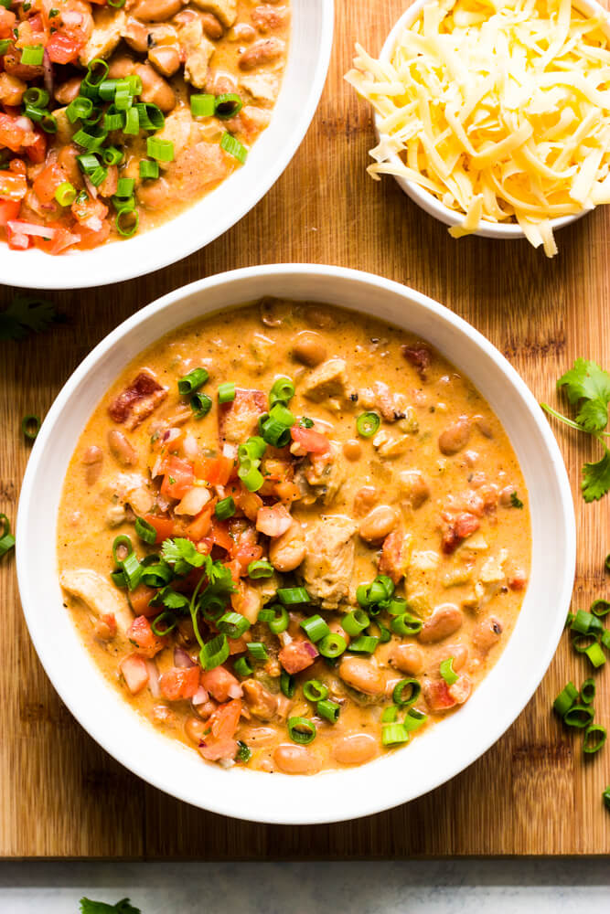 Overheat view of creamy chili in a white bowl