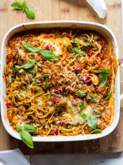 Overhead view of spaghetti and zucchini bake in white casserole dish