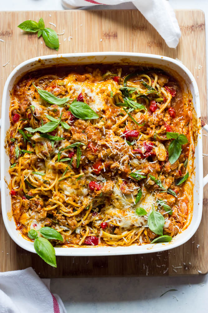 Overhead view of spaghetti and zucchini bake in white casserole dish