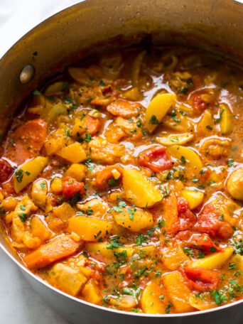 Overhead shot of chicken stew in a dutch-oven