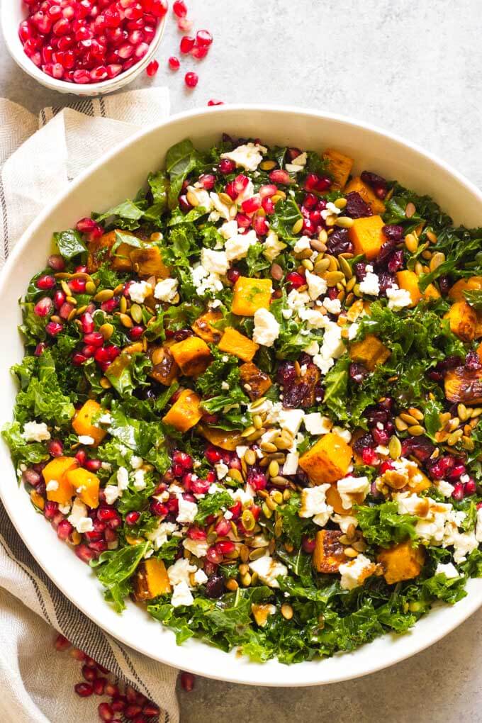 Close up of kale salad in white bowl