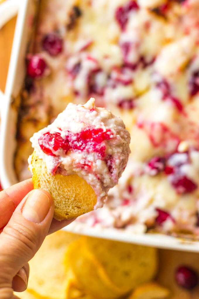 Close up of cranberry dip on a toasted crostini.