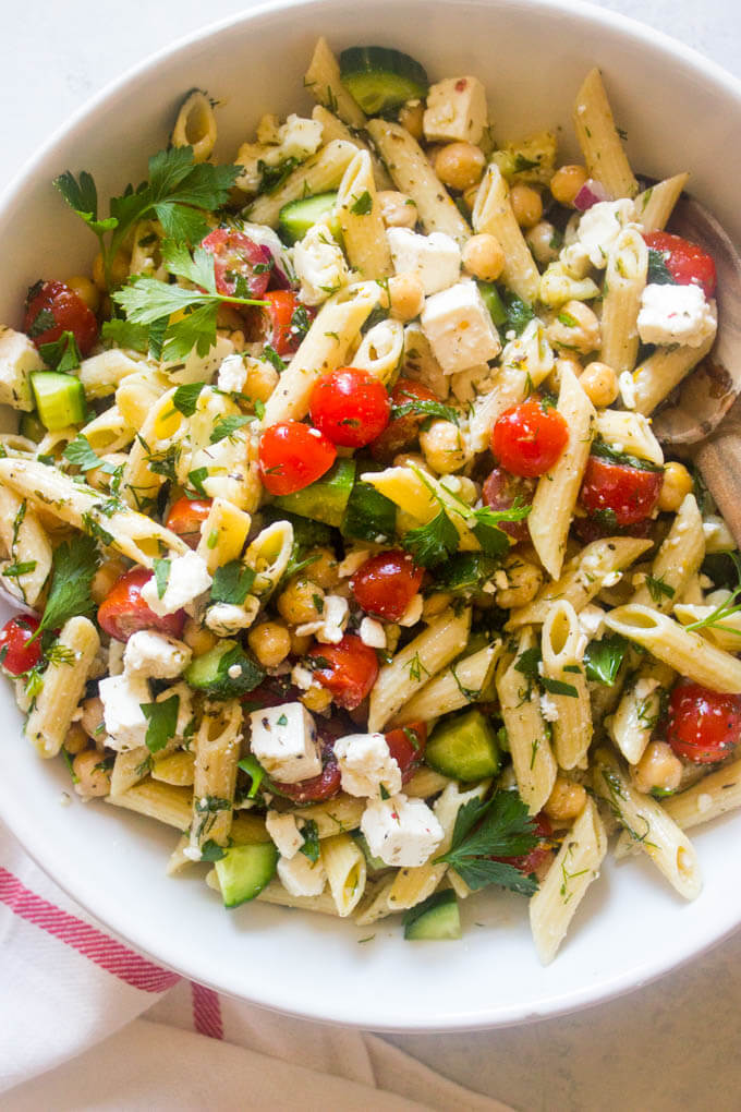 Close up of italian pasta salad in white bowl