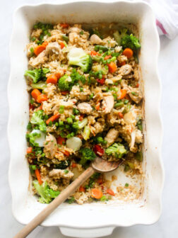 Close up of baked teriyaki chicken in white casserole dish
