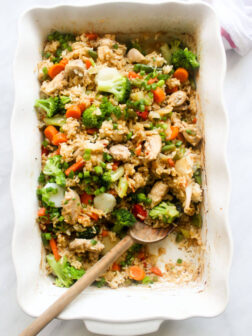 Close up of baked teriyaki chicken in white casserole dish