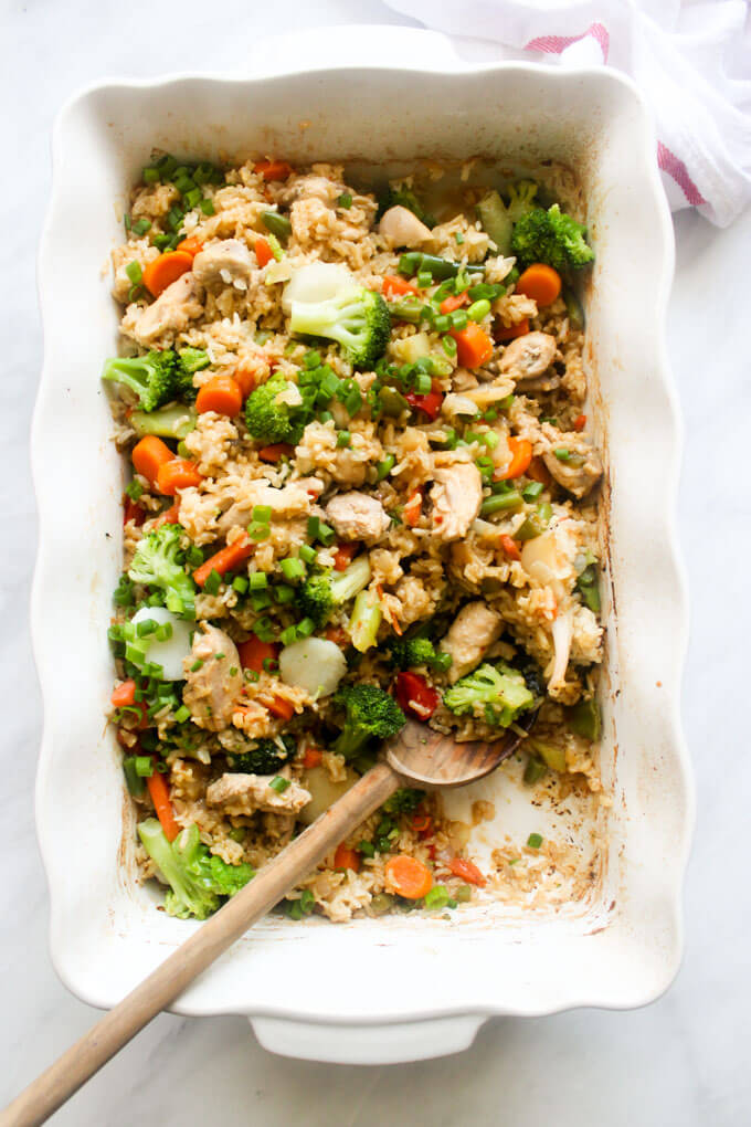 Close up of baked teriyaki chicken in white casserole dish