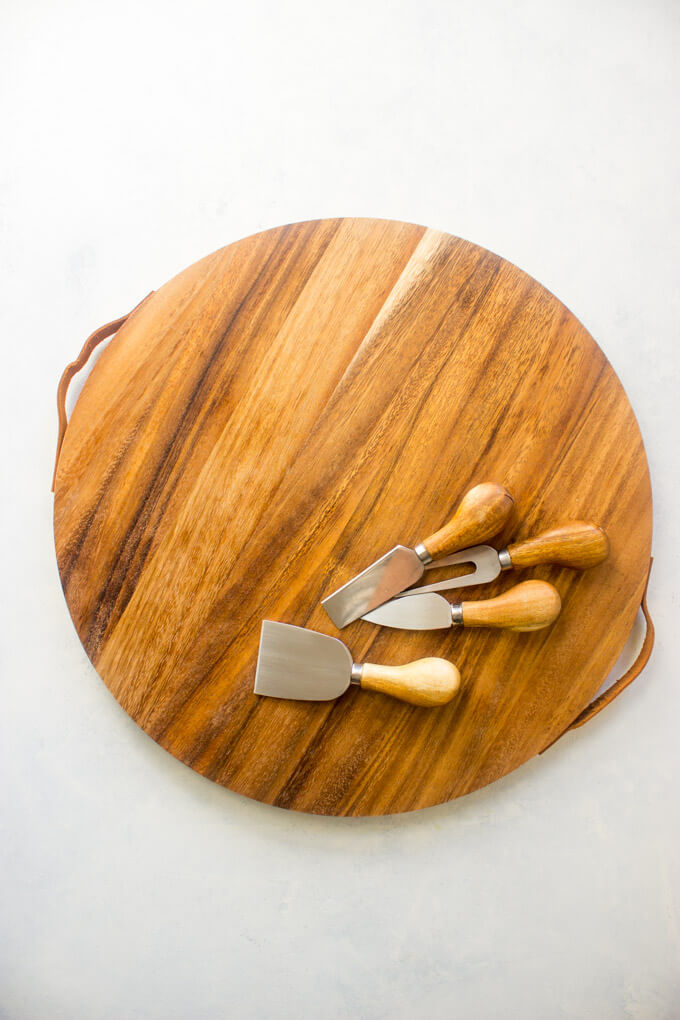 Cheese board with cheese servers