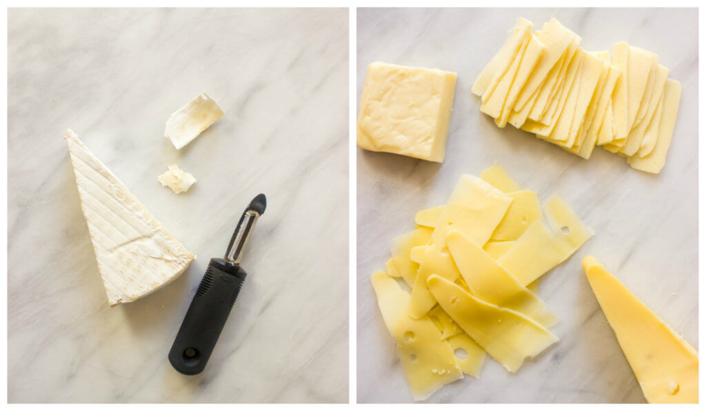 Sliced cheese on white board 