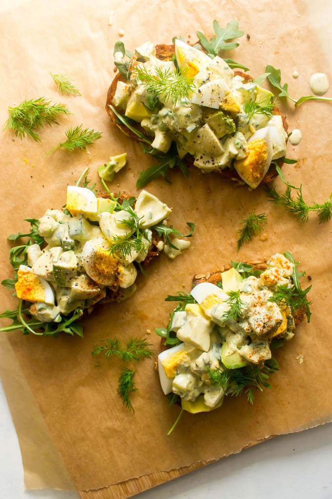 Overhead avocado egg salad on brown paper