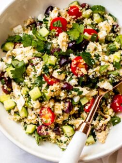 Close up of lemon chicken quinoa salad in white bowl