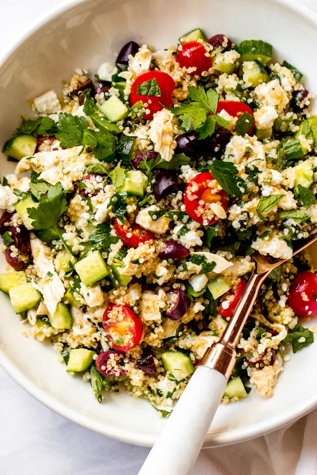 Close up of chicken quinoa salad in white bowl