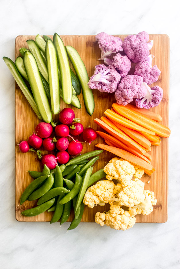 Cut up vegetables on wooden board